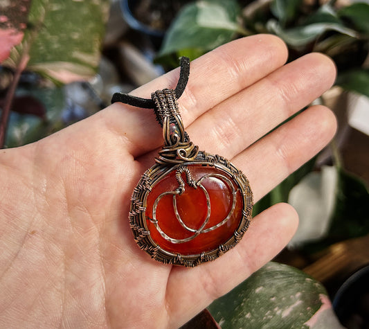 Copper pumpkin pendant with fire opal and red onyx stones