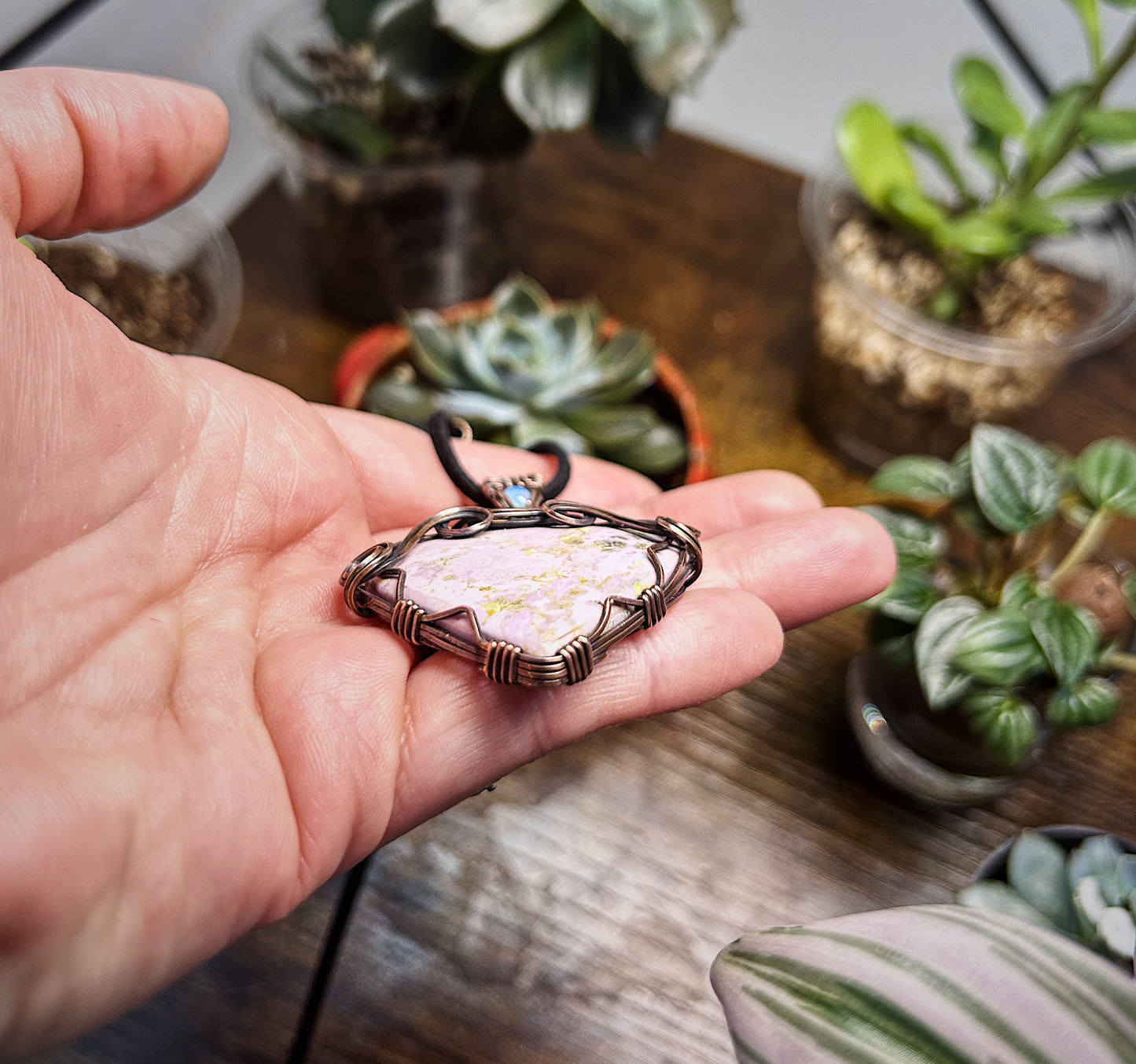 Phosphosiderite stone wrapped in antiqued copper and accented with opal