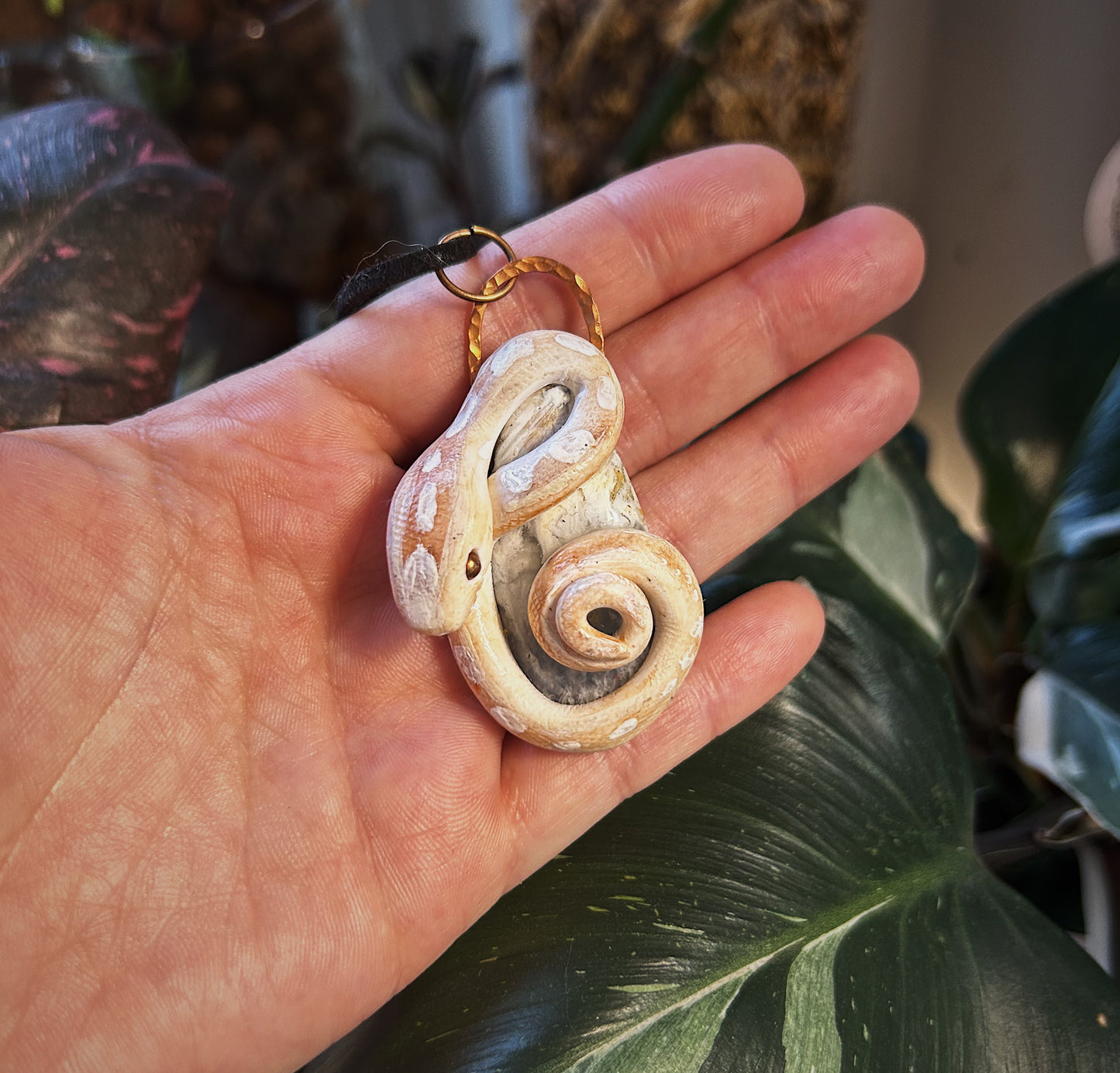 Clay snake over Snow palm agate