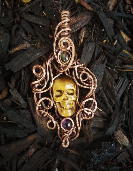 Tigers Eye Skull Stone Oxidized Copper Wire Wrapped Pendant Accented with a Fire Opal and Amythest Stone.